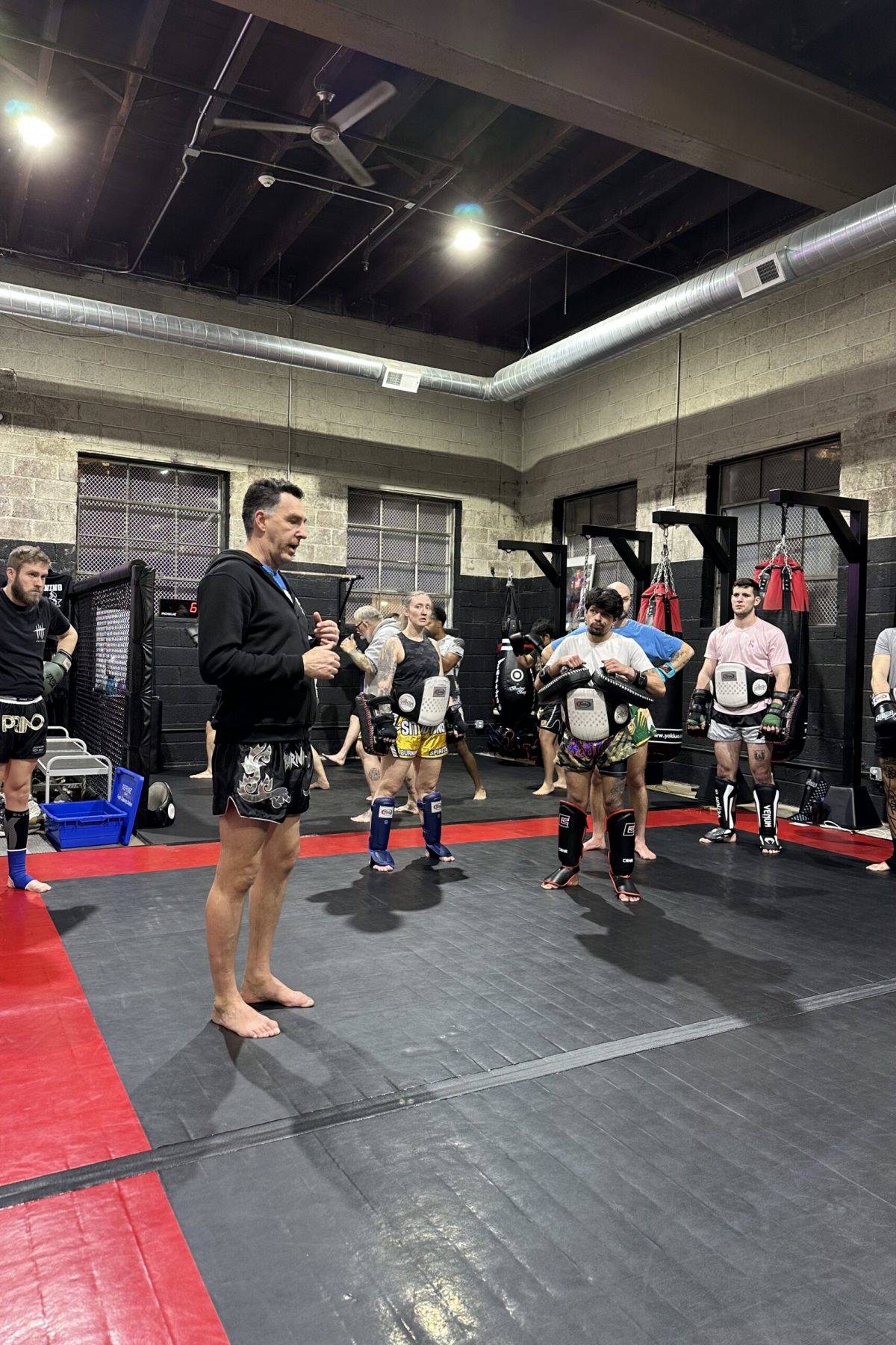 coach teaching students muay thai